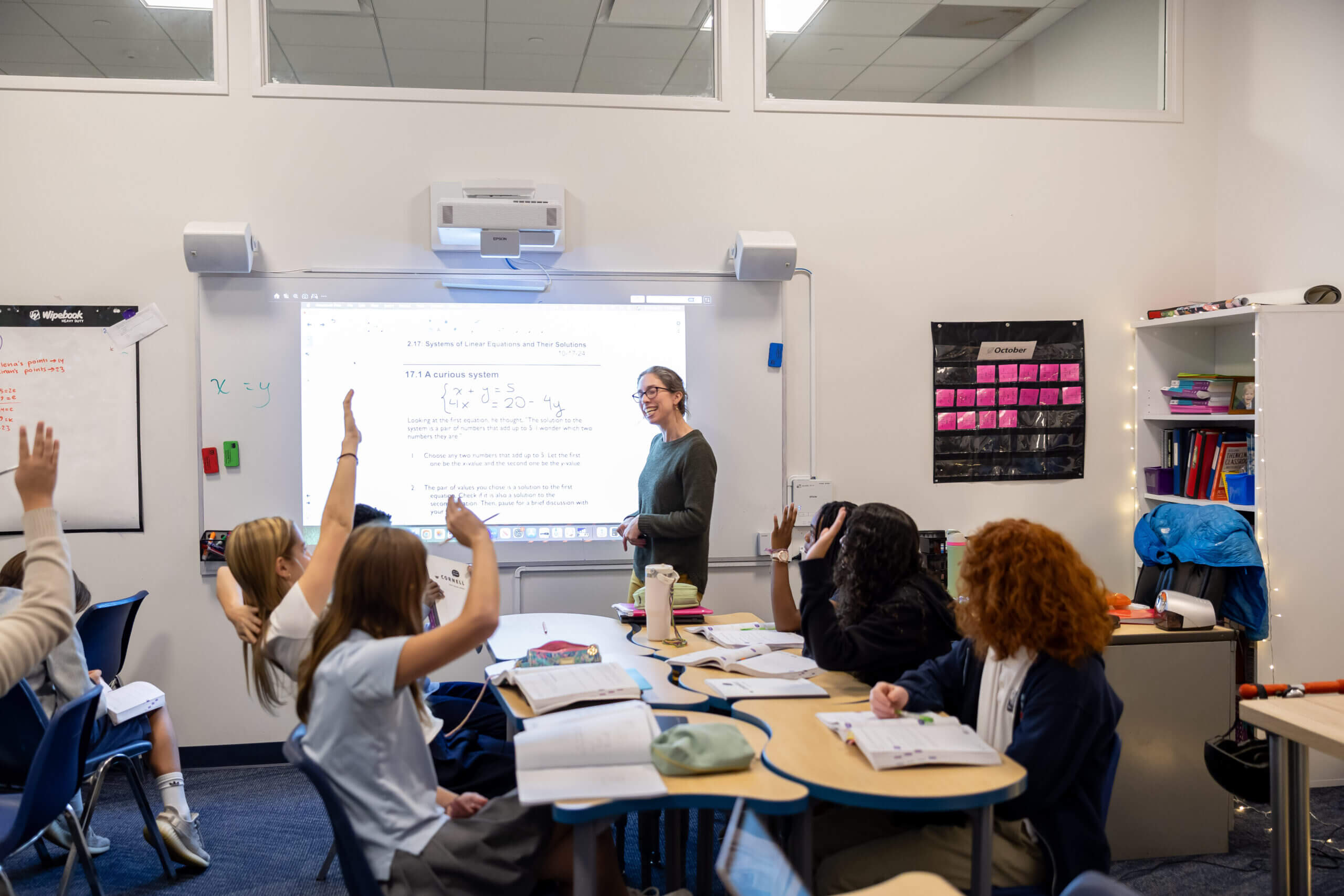 A Teacher working closely with a Middle school student