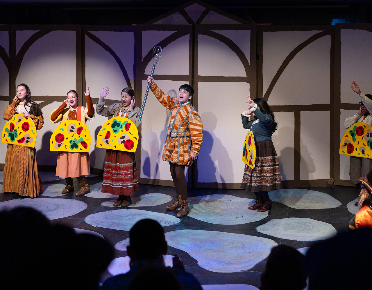 Middle School students performing a play