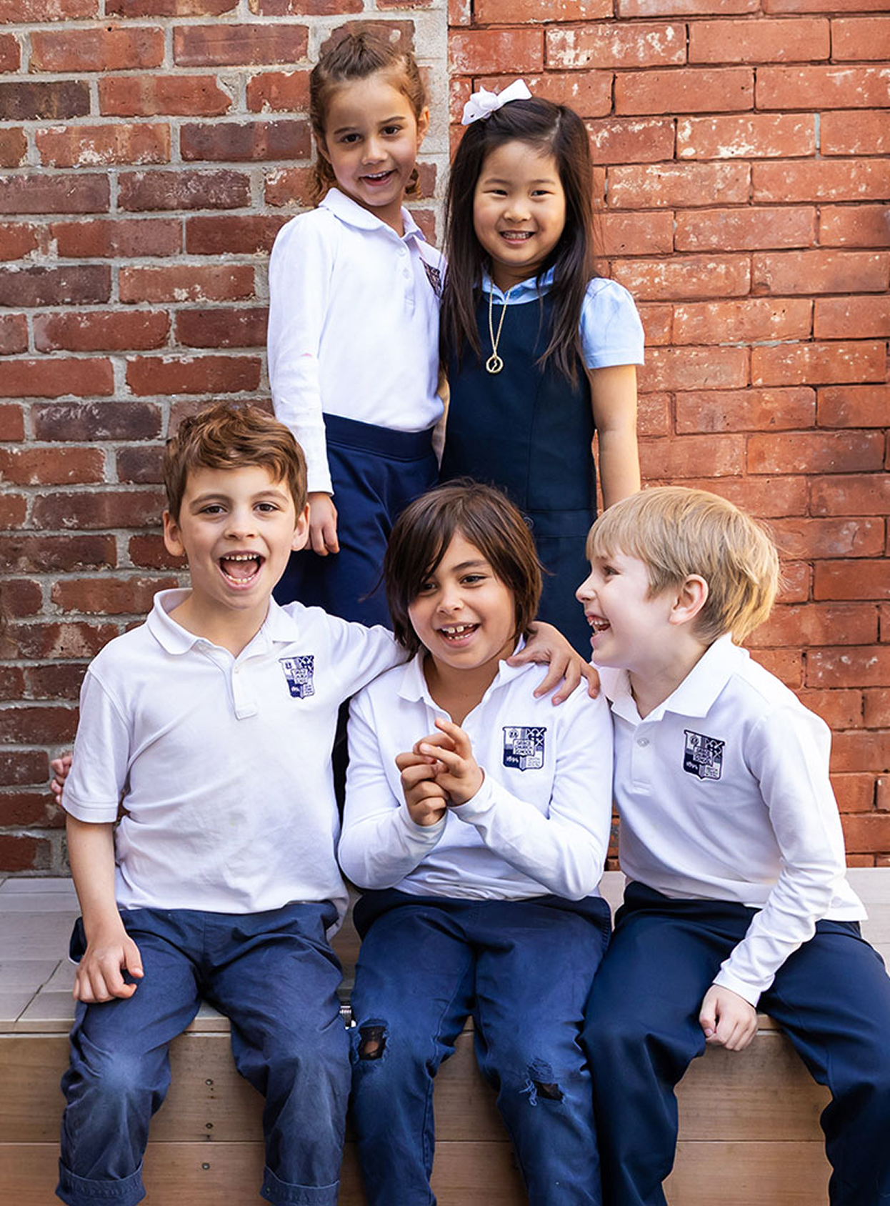 A group of 5 Lower School Students posing for a picture together.