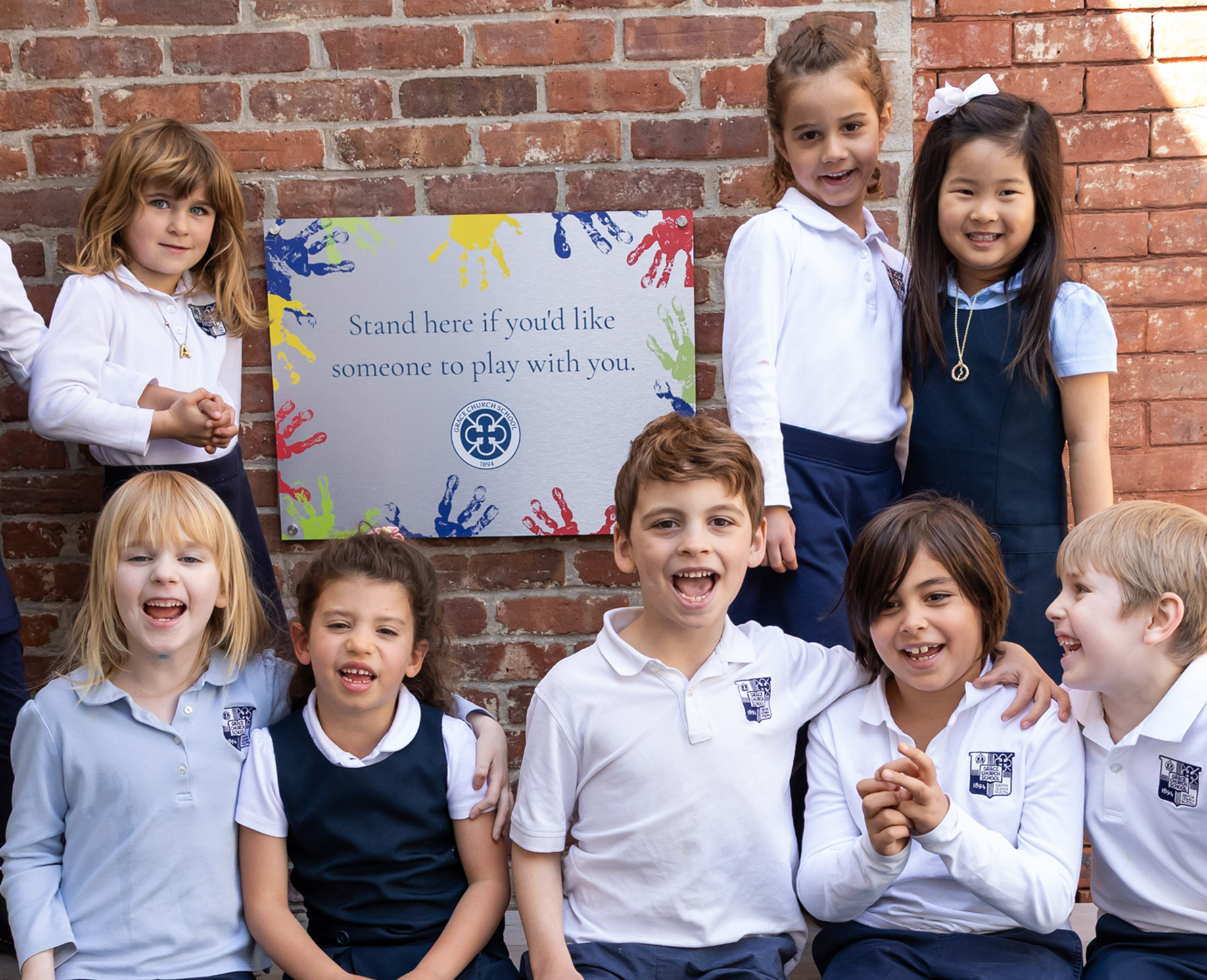 Lower school student sitting together during recess